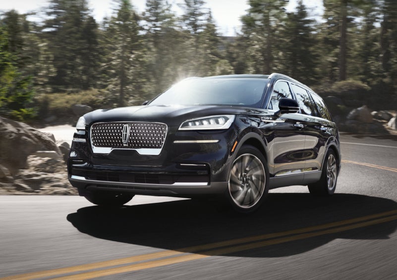 A Lincoln Aviator® SUV is being driven on a winding mountain road | Caruso Lincoln in Long Beach CA