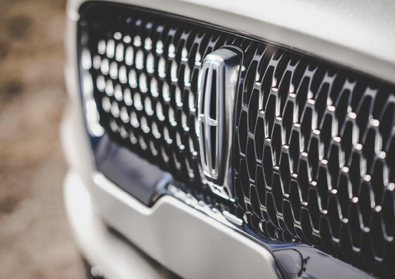 The grille of the 2024 Lincoln Aviator® Reserve model with an eye-catching repeated field of Lincoln Star logo shapes | Caruso Lincoln in Long Beach CA