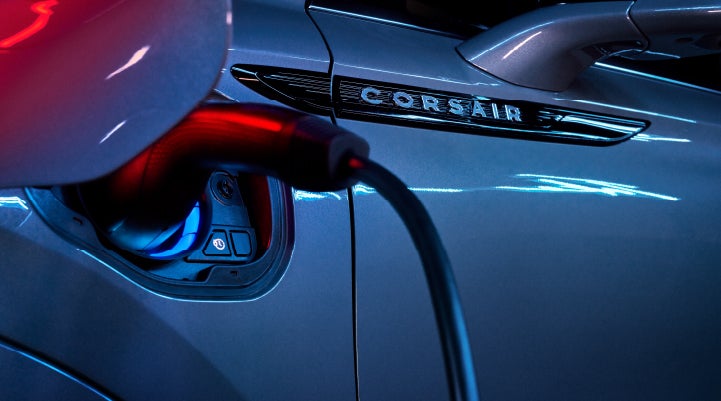 A charger plugged into the charging port of a 2024 Lincoln Corsair® Plug-in Hybrid model. | Caruso Lincoln in Long Beach CA